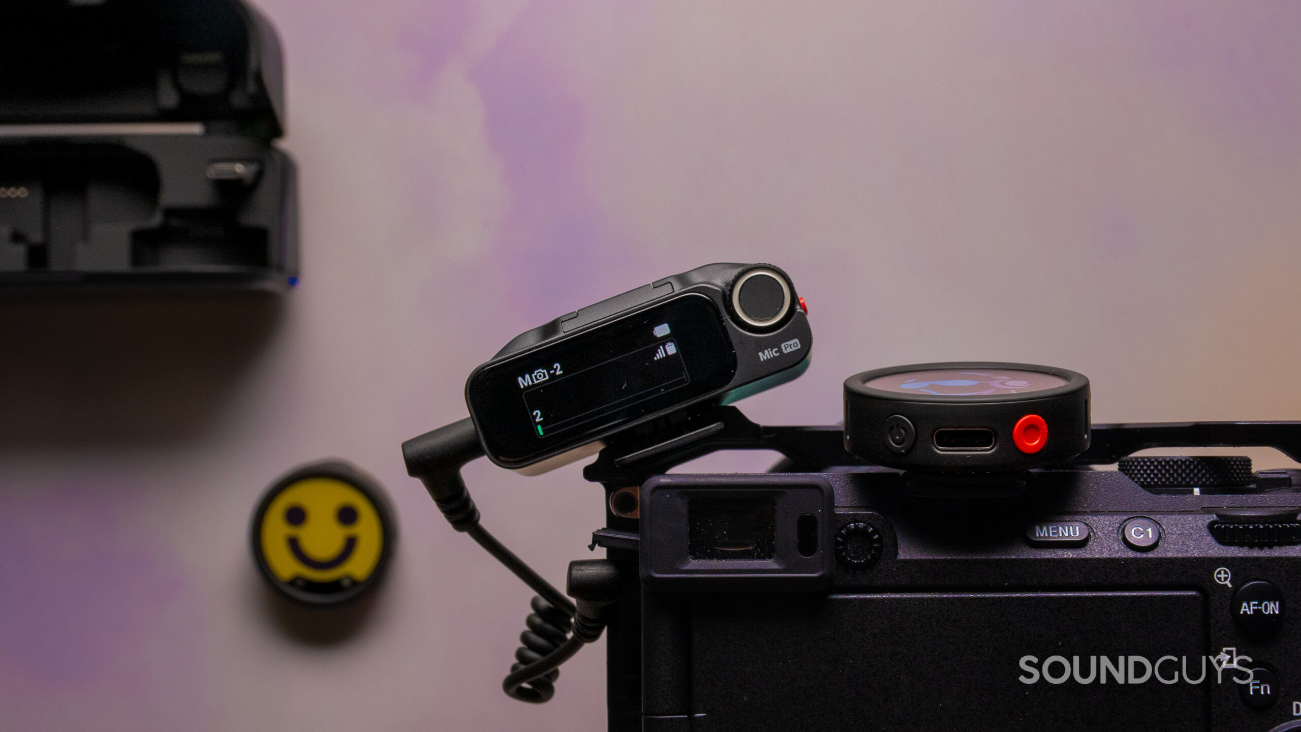 Insta360 Mic Pro close up on camera Insta360 Mic Pro receiver and transmitter mounted on a mirrorless camera.