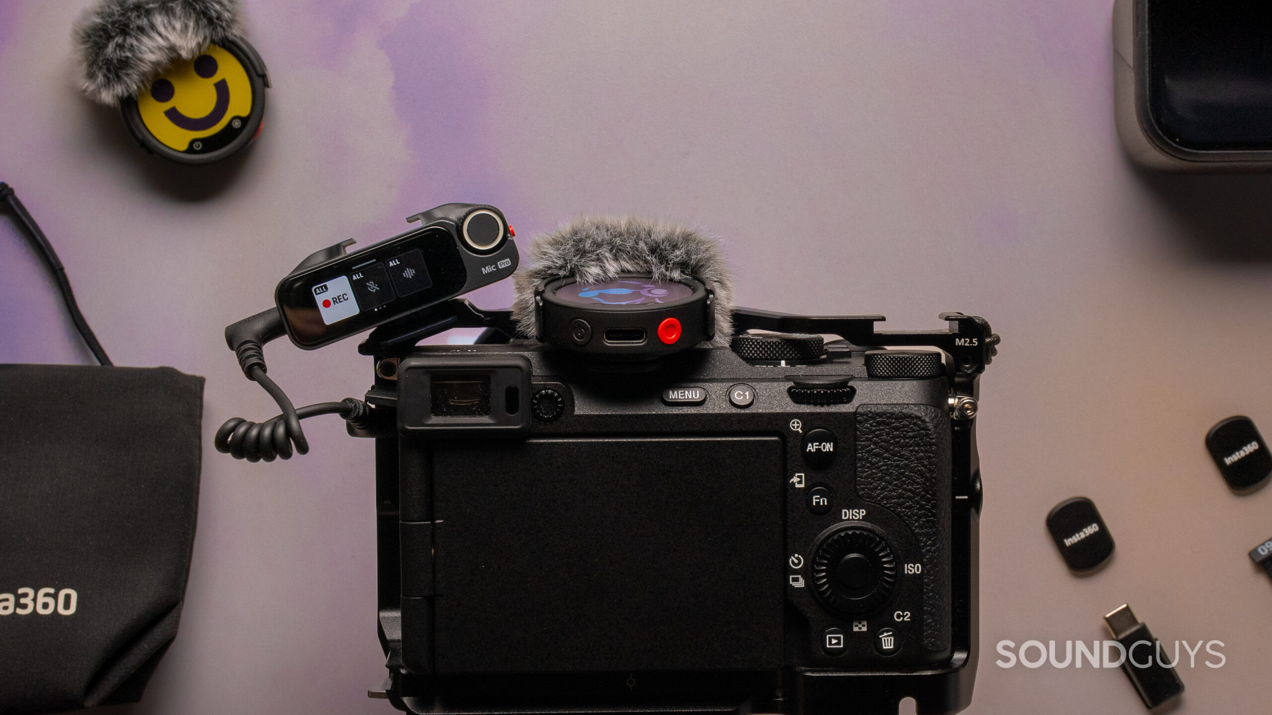 Insta360 Mic Pro on camera Insta360 Mic Pro receiver and transmitter mounted on a mirrorless camera.