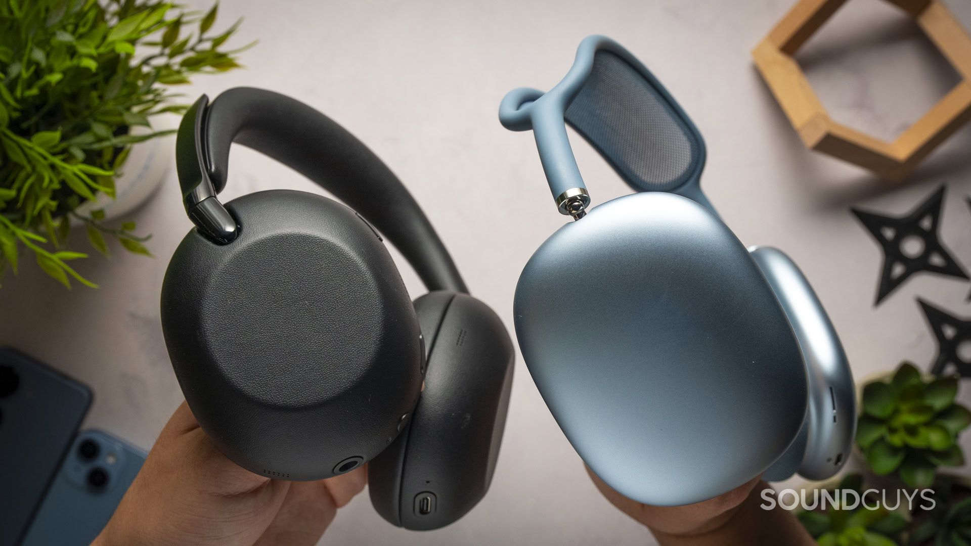 Sony WH-1000XX The Collexion Vs-8 Top down photo of the Sony WH-1000X The Collexion headphones next to a pair of Apple AirPods Max 2 headphones.