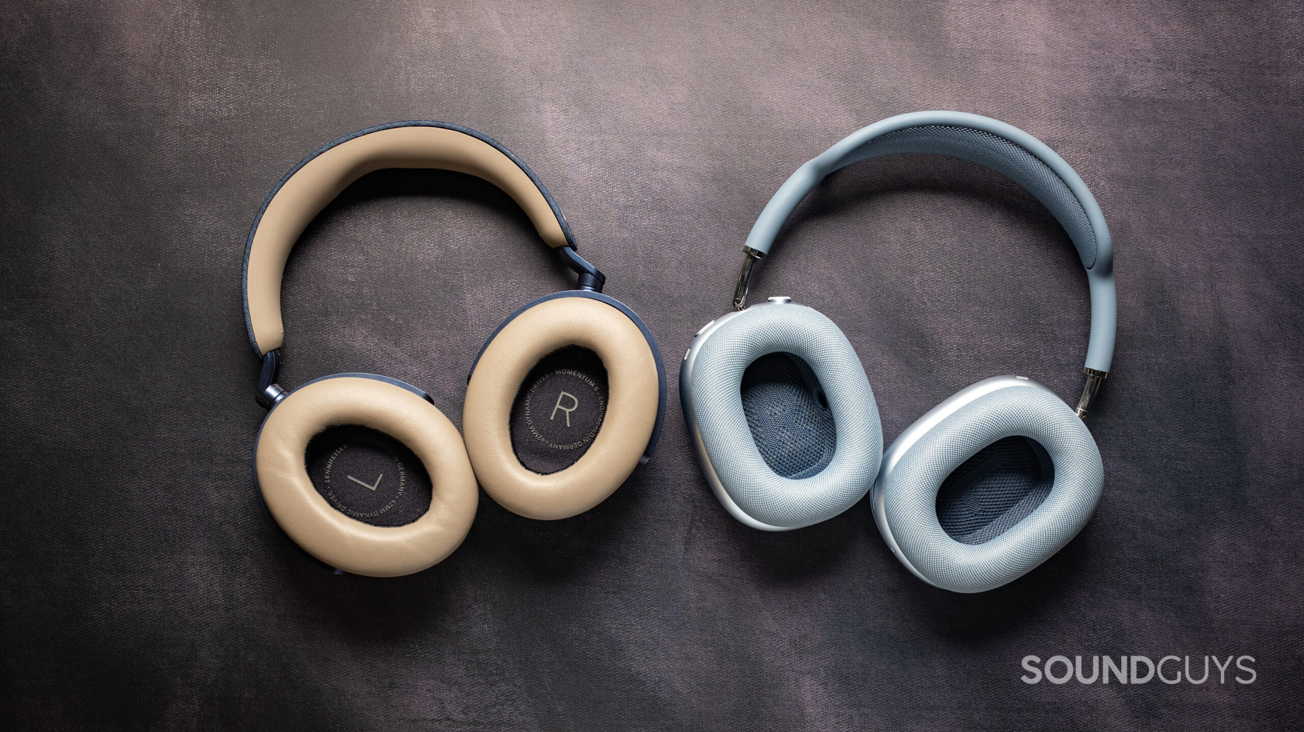 sennheiser momentum 5 wireless headphones vs. apple airpods max 2_ear cups Top down photo of the Sennheiser MOMENTUM 5 Wireless headphones next to the Apple AirPods Max 2, showing the insides of their ear cups.
