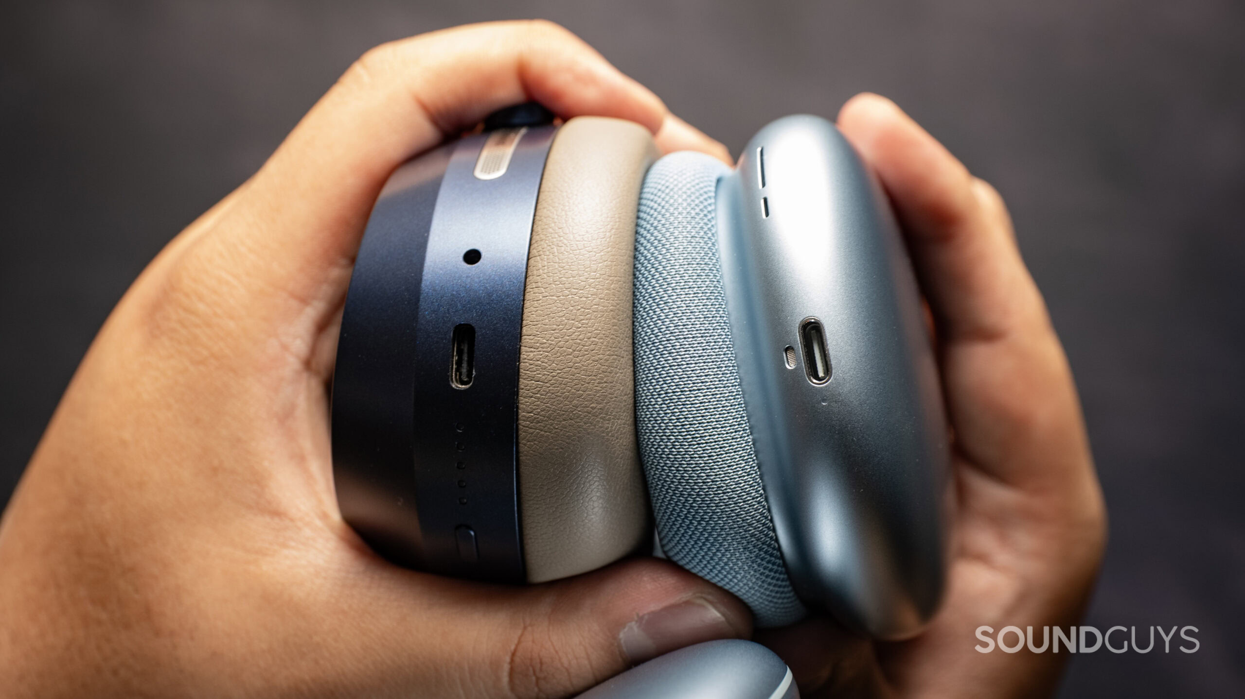 sennheiser momentum 5 wireless headphones vs. apple airpods max 2_ports Top down photo of the Sennheiser MOMENTUM 5 Wireless headphones next to the Apple AirPods Max 2, showing their USB-C ports.