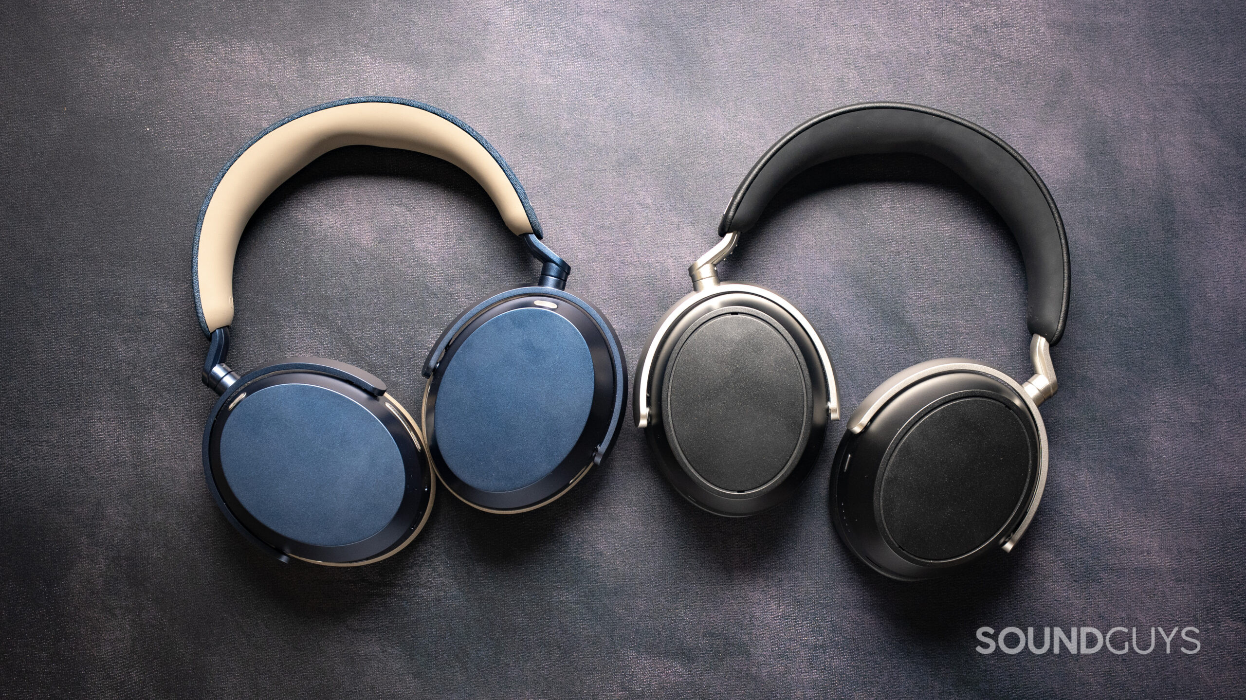 A photo of the Sennhieser MOMENTUM 5 Wireless sitting next to the Sennheiser HDB 630 on a table.