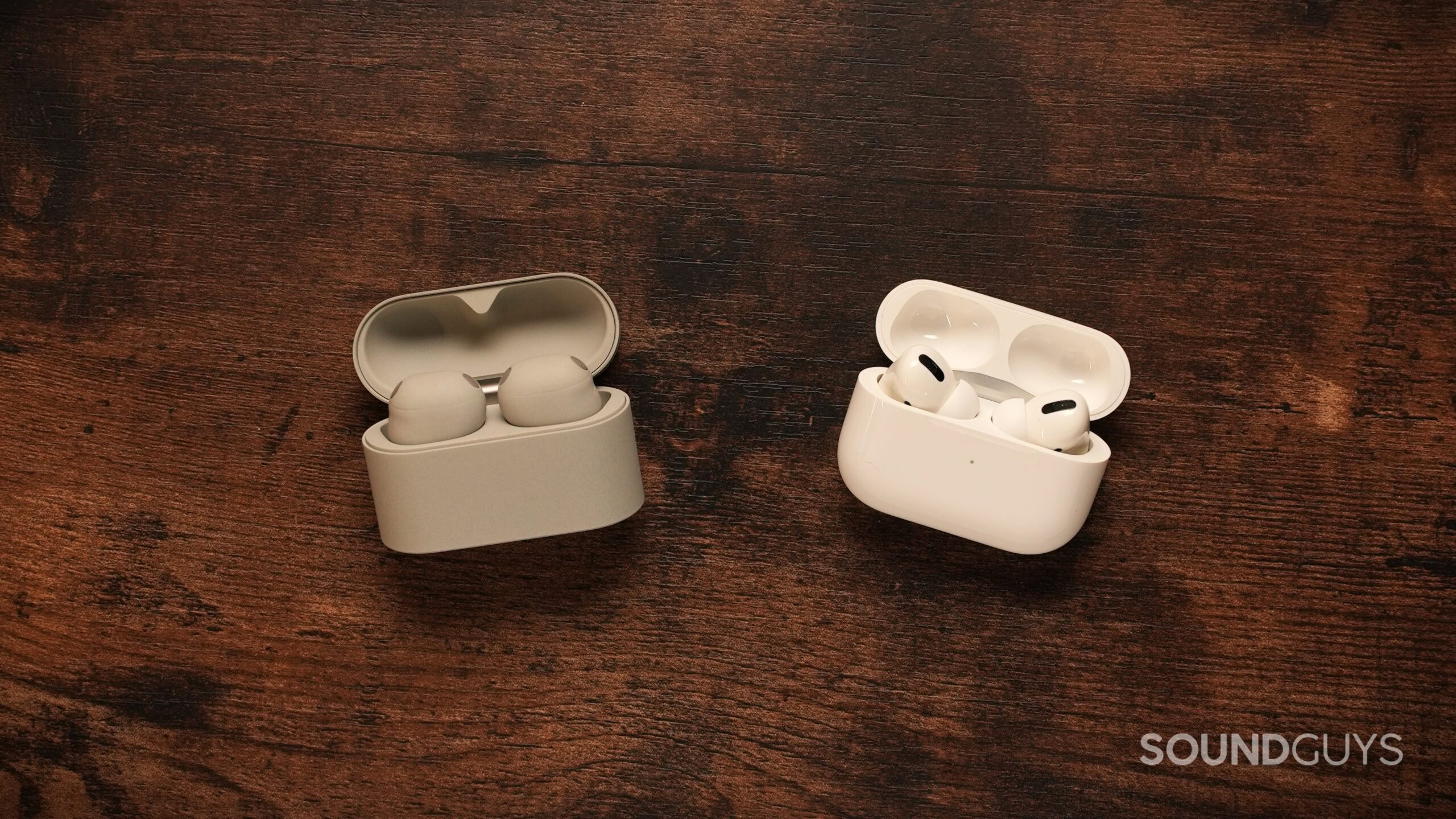 sony wf-1000xm6 vs airpods pro 2 sony wf-1000xm6 vs airpods pro 2 on a wooden table