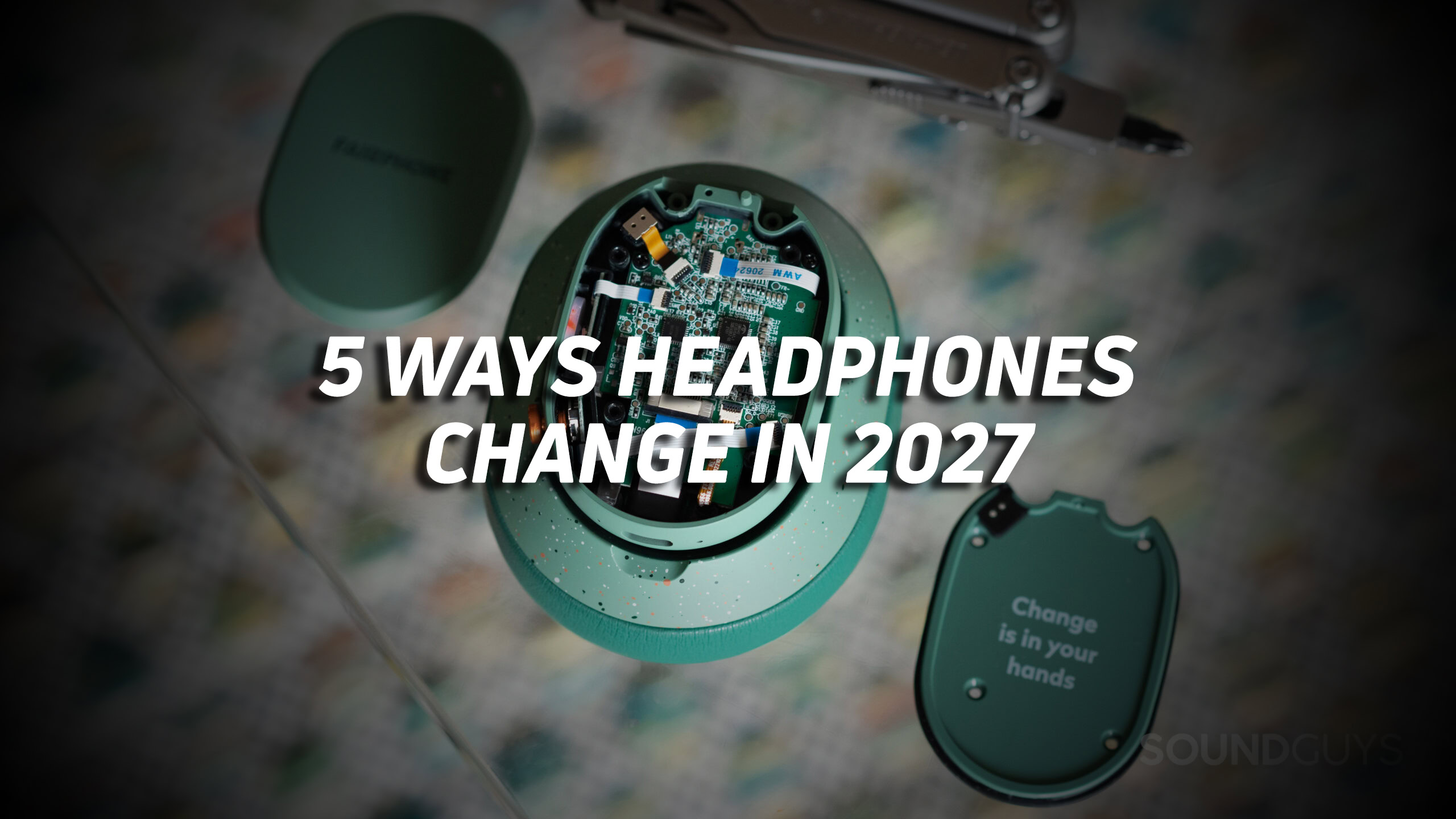 A photo of a taken-apart set of ANC headphones, with the text "5 ways headphones change in 2027" overlaid.