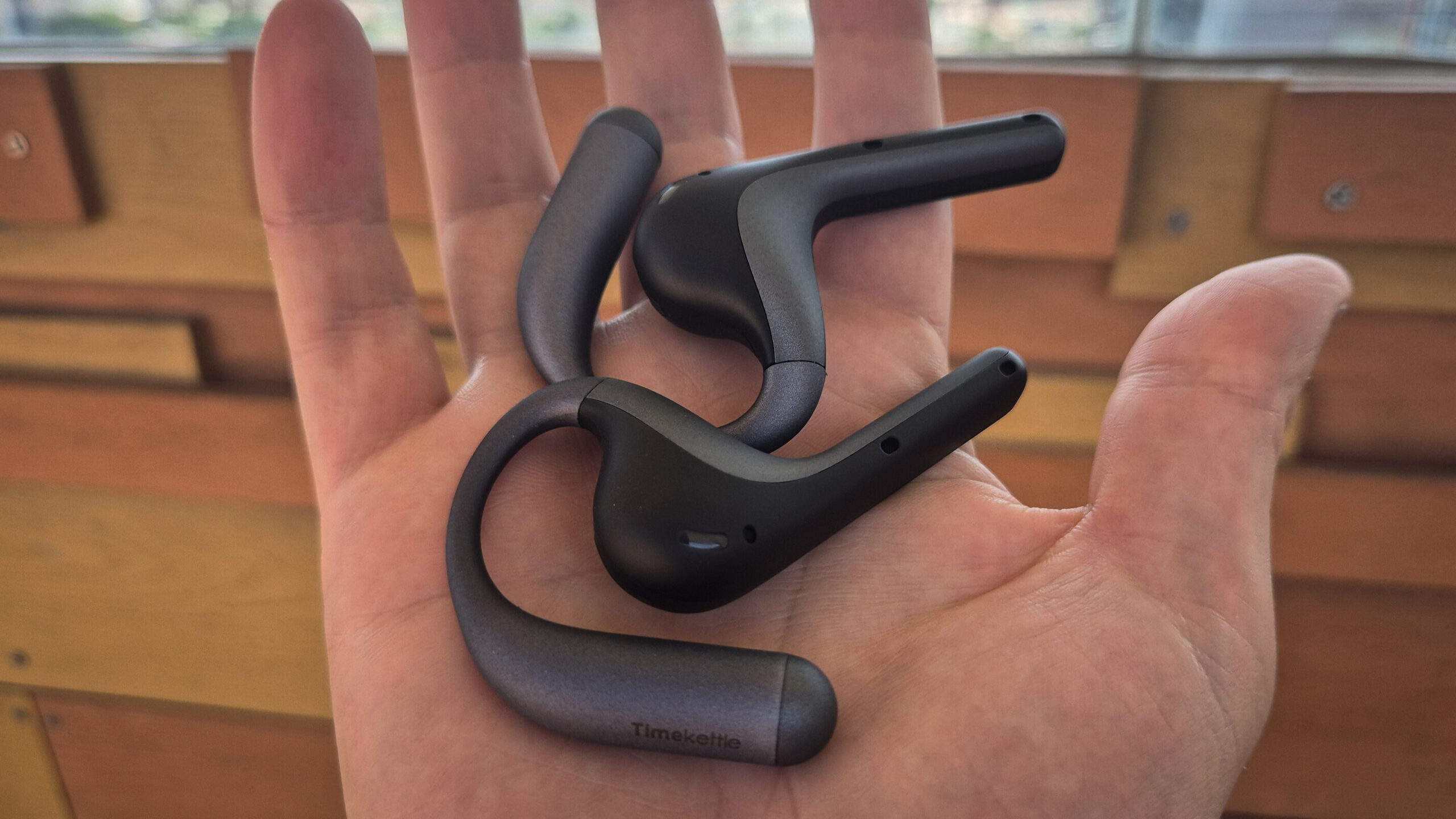 TimeKettle-W4-Pro-AI-Interpreter-Earbuds-In-Hand