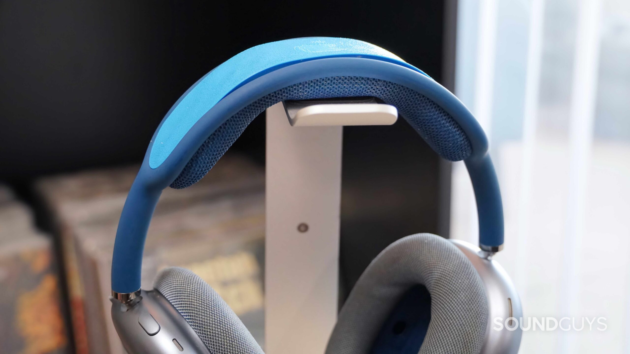 How the AirPods Max sit on a stand with the TPU insert installed.