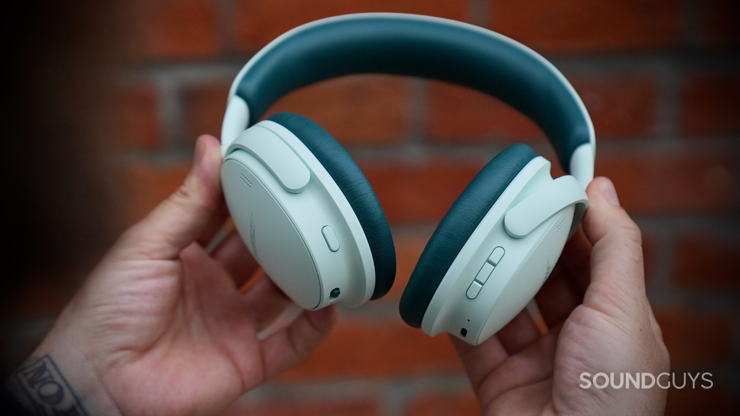 A close-up of the physical controls and ports on the Bose QuietComfort Headphones (2nd Gen).