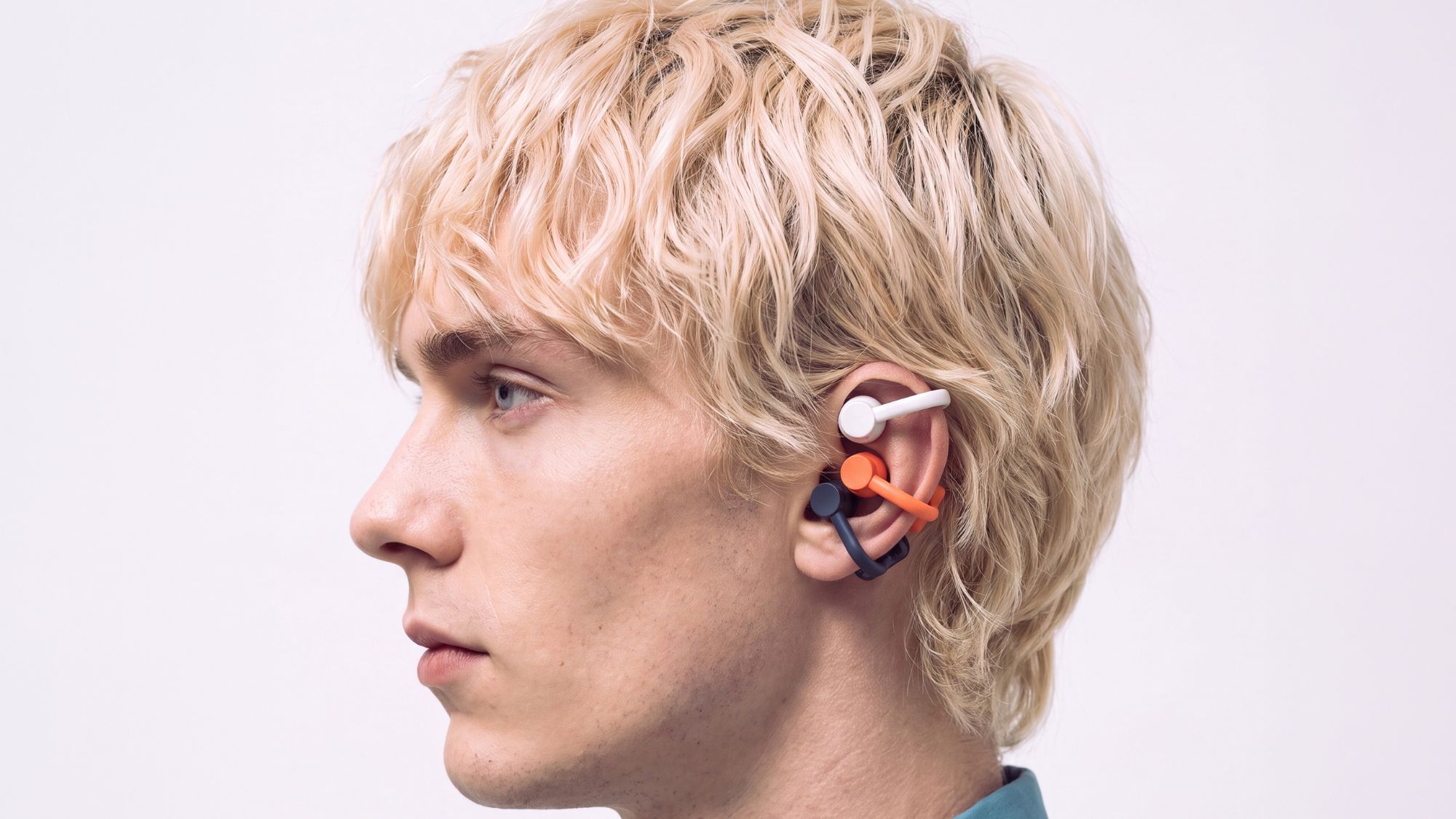 CMF Clip Pro all colored-buds on a person's ear
