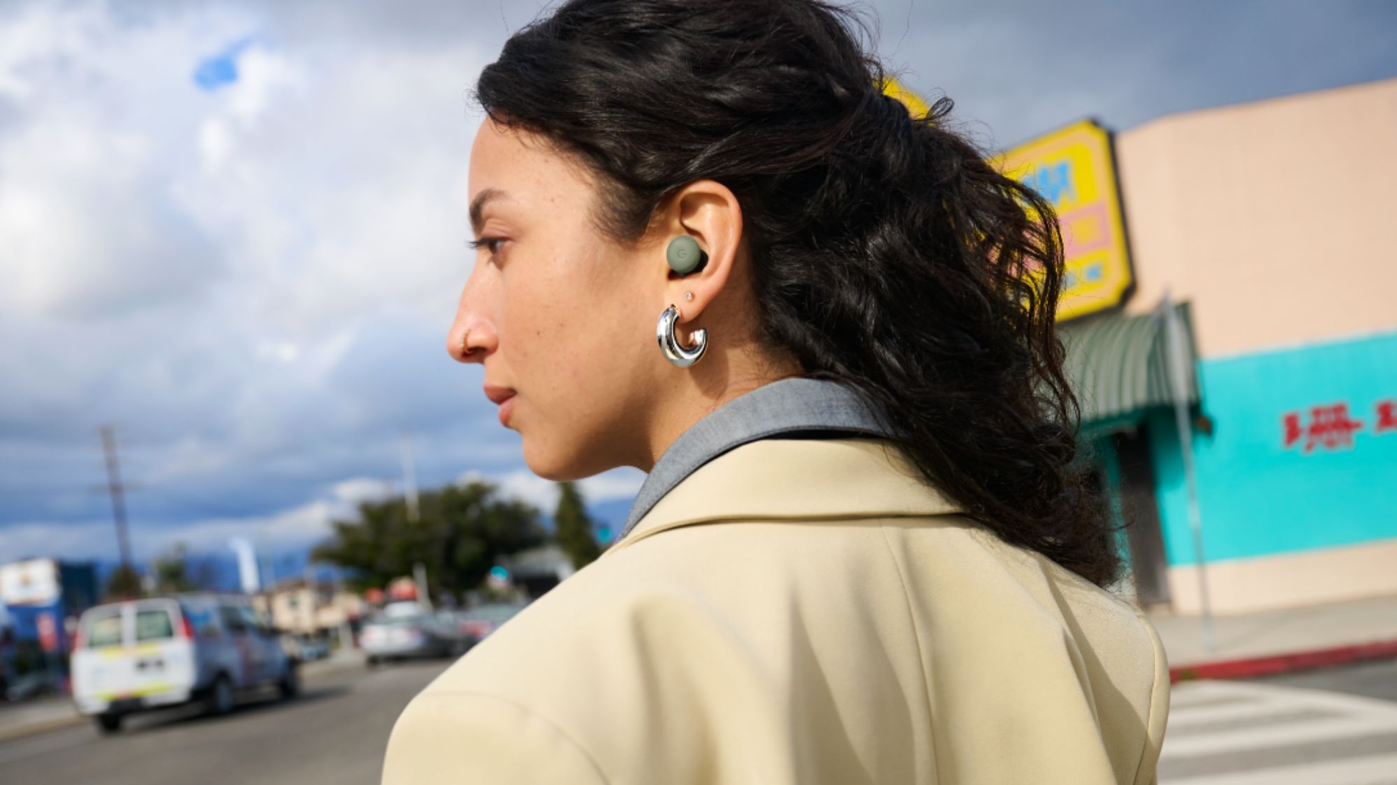 Pixel Buds Pro 2 new olive color in a woman's ears
