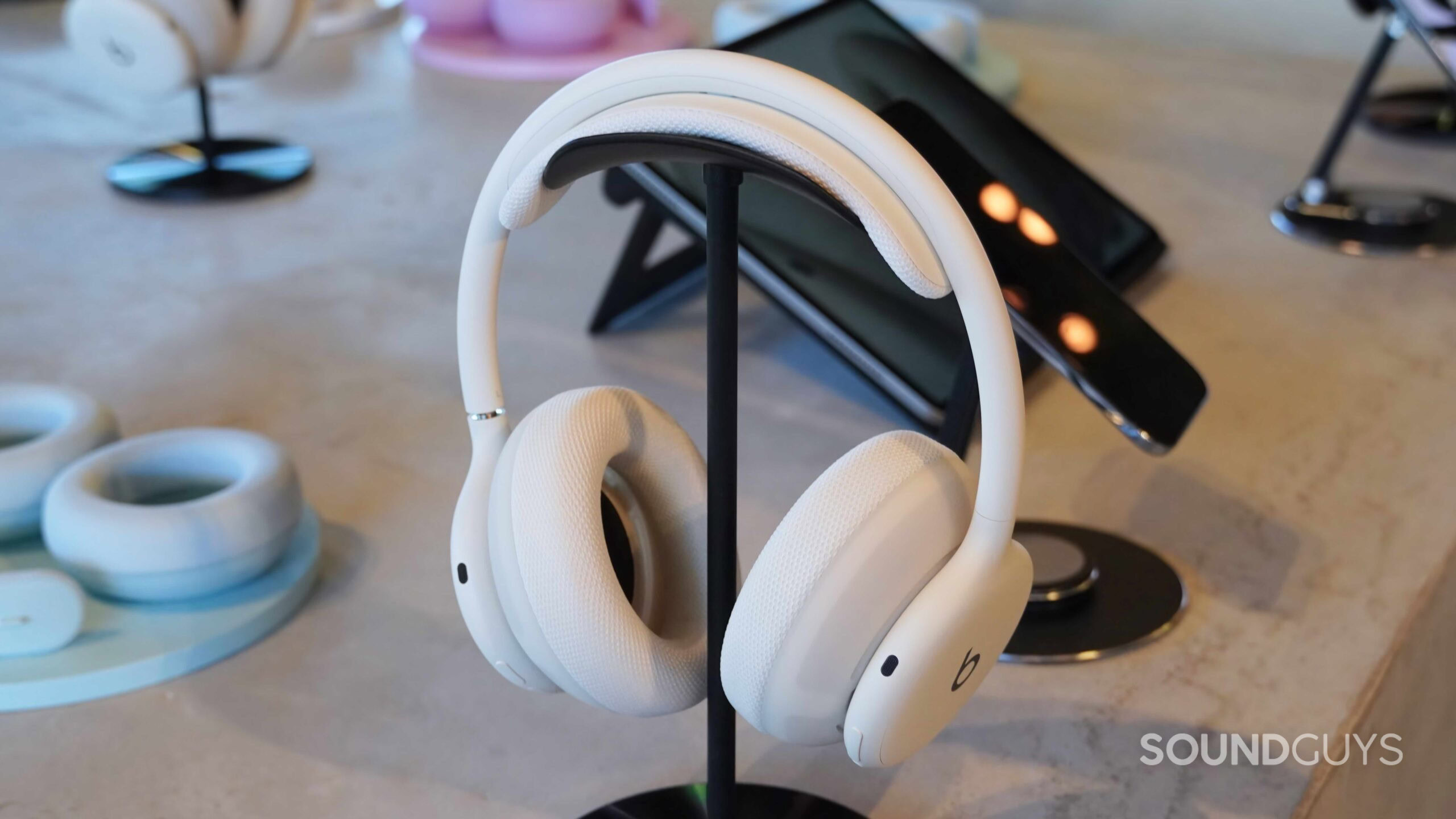 Beats-360-review-2 White Beats 360 headphones on a stand.