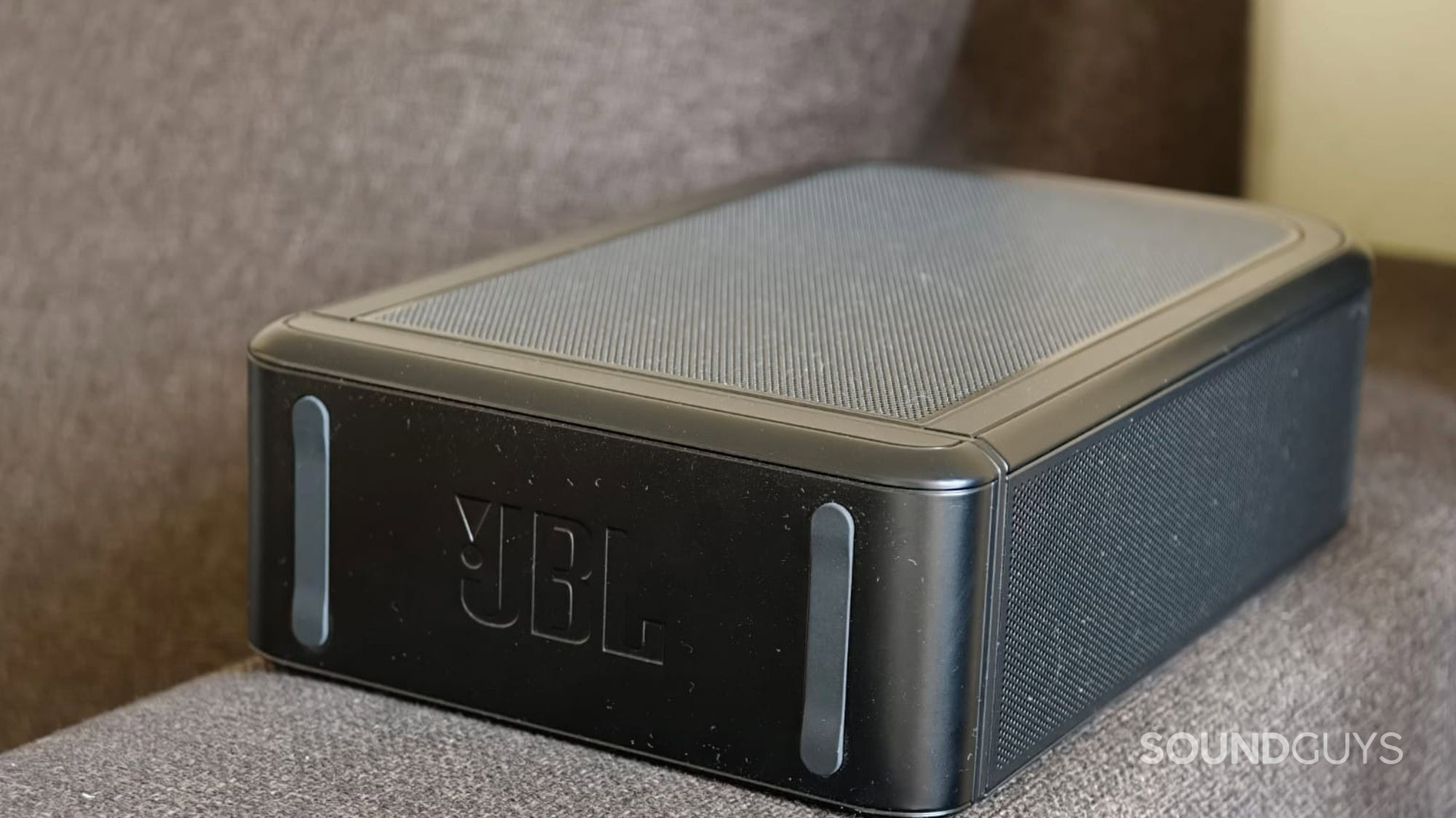 JBL Bar 1300MK2 detachable speakers on each side of the couch