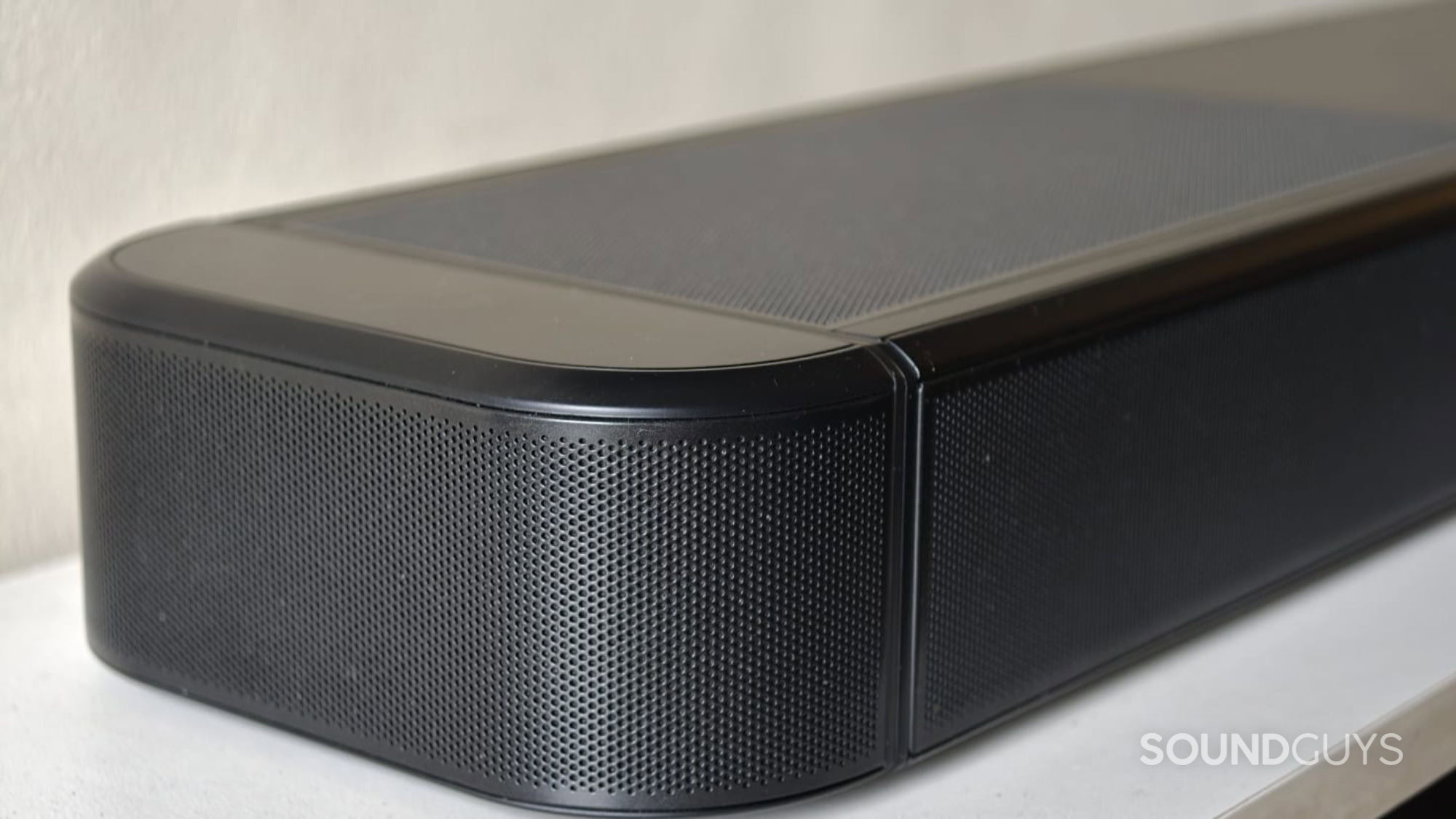 JBL Bar 1300MK2 soundbar sides on the TV cabinet