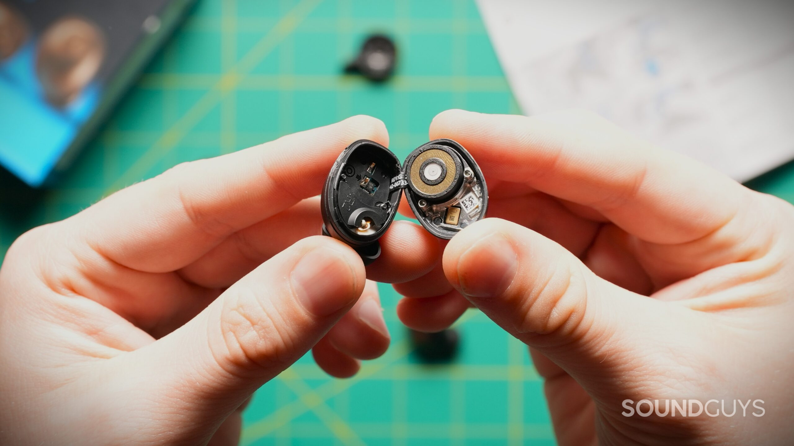 MTW5 open earbud battery A disassembled Sennheiser Momentum True Wireless 5 earbud reveals its driver, battery, and internal circuitry.