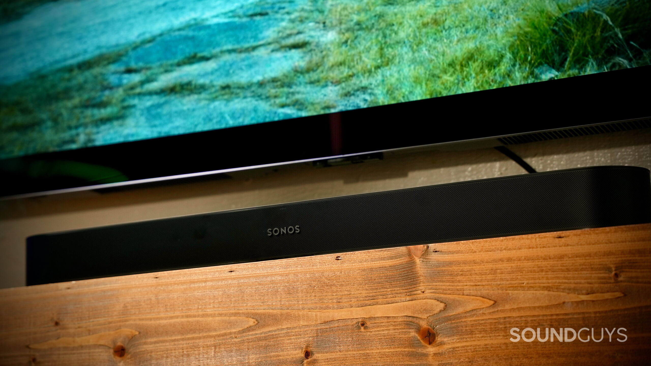 Sonos Beam Ultra - 1 Sonos Beam Ultra soundbar beneath a TV in a living room