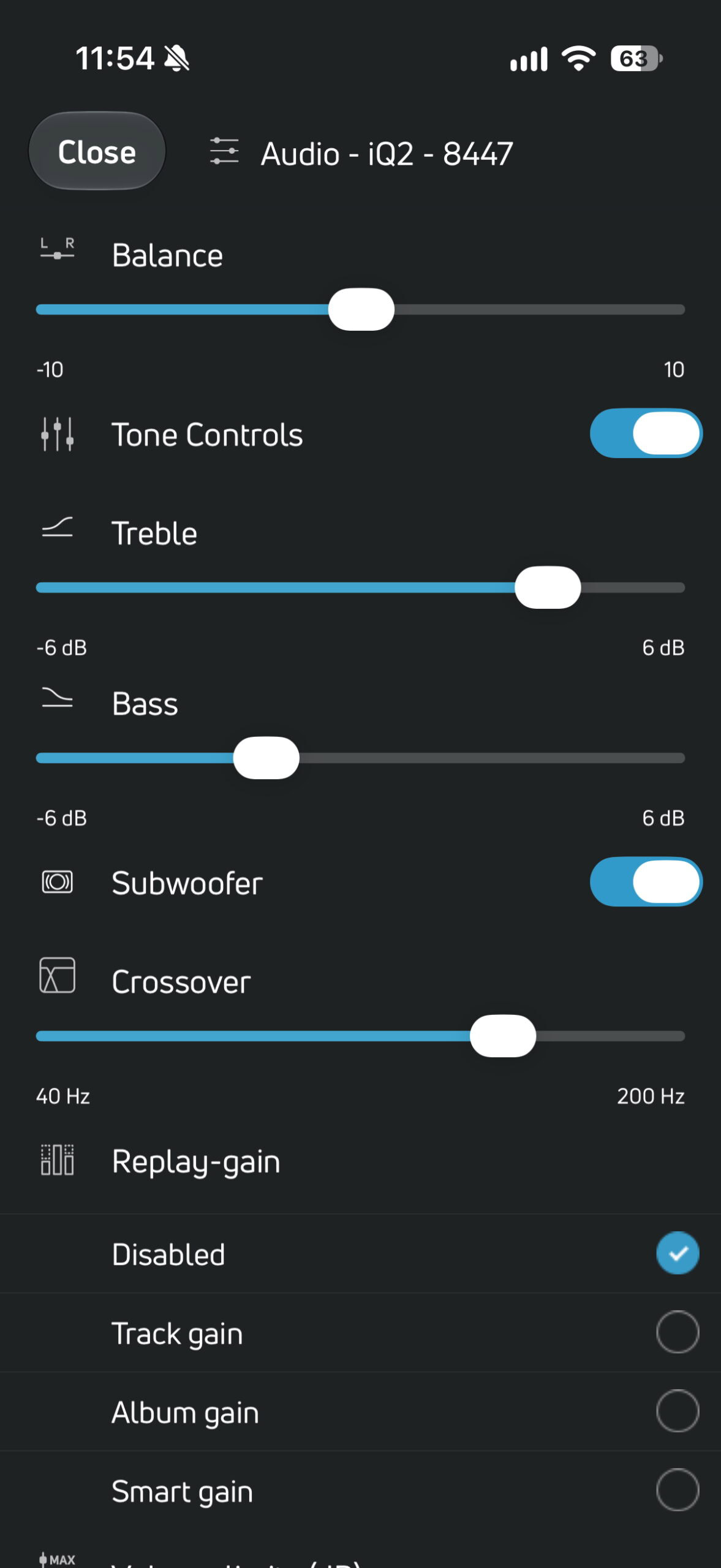 BluOS Controller app showing treble, bass, subwoofer, and crossover controls for the PSB iQ2