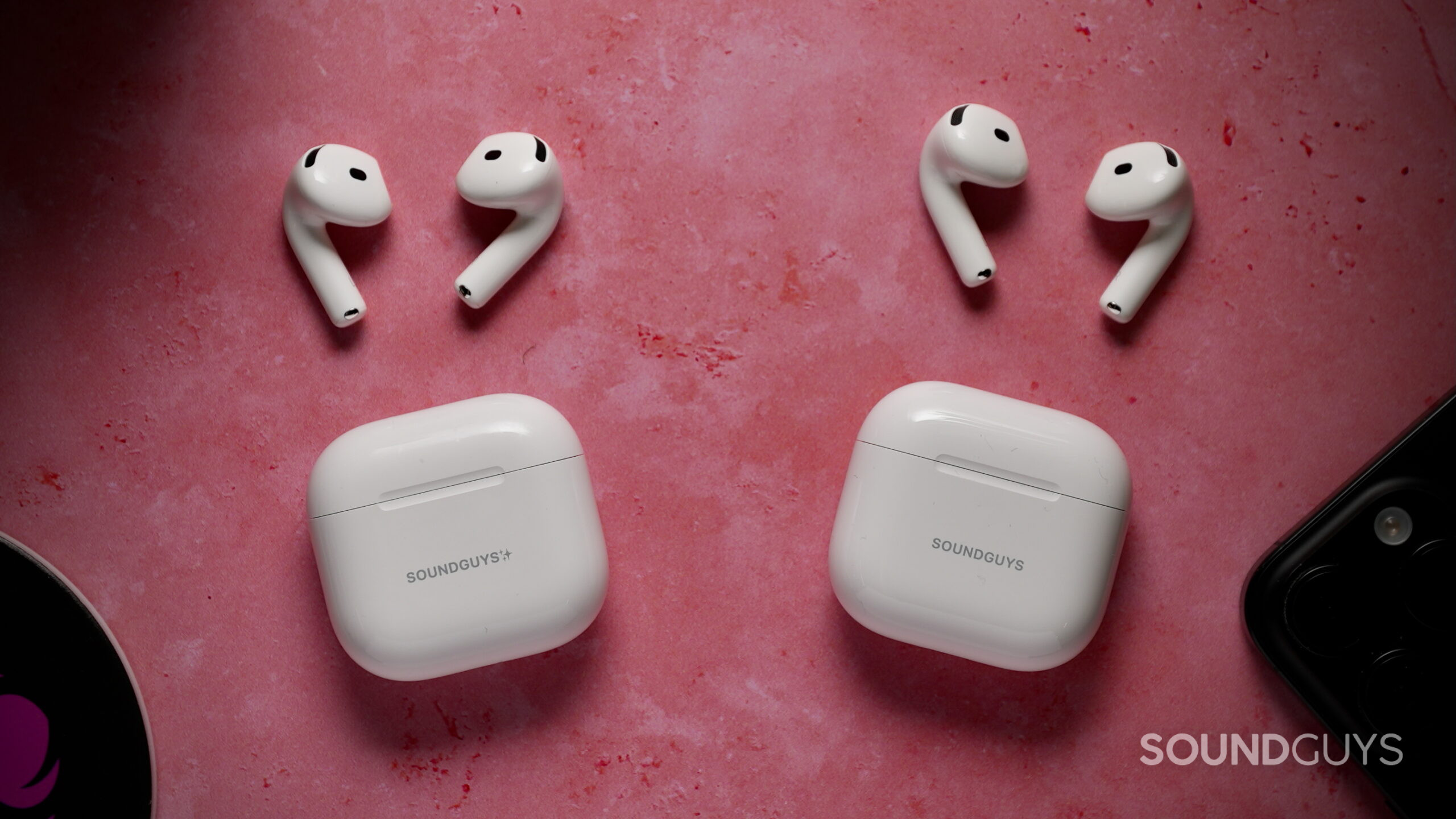 AirPods 4 w- Active Noise Cancellation vs AirPods 5 with Wireless Charging Case - 3 AirPods 4 with ANC and AirPods 5 earbuds beside their charging cases