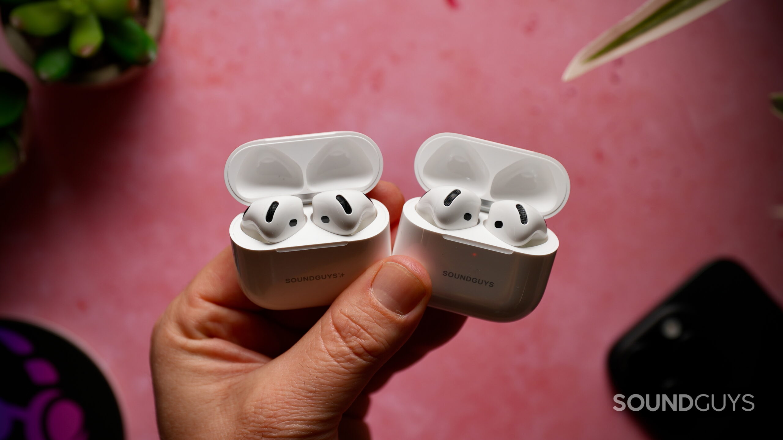 AirPods 4 w- Active Noise Cancellation vs AirPods 5 with Wireless Charging Case - 4 AirPods 4 with ANC and AirPods 5 in their open charging cases