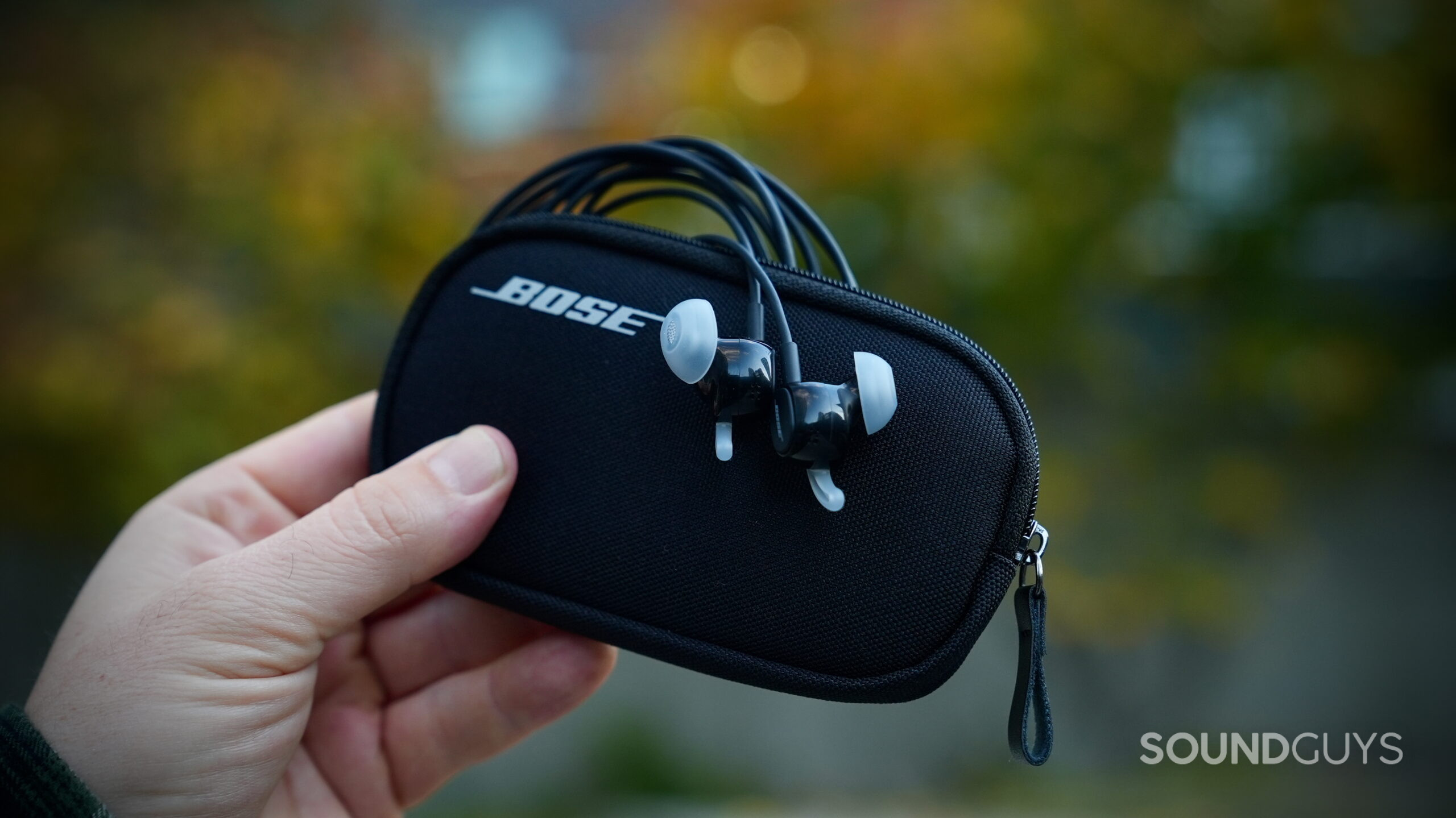 Bose Noise Canceling Wired Earbuds - 10 Bose Noise Cancelling Wired Earbuds resting on their carrying case.