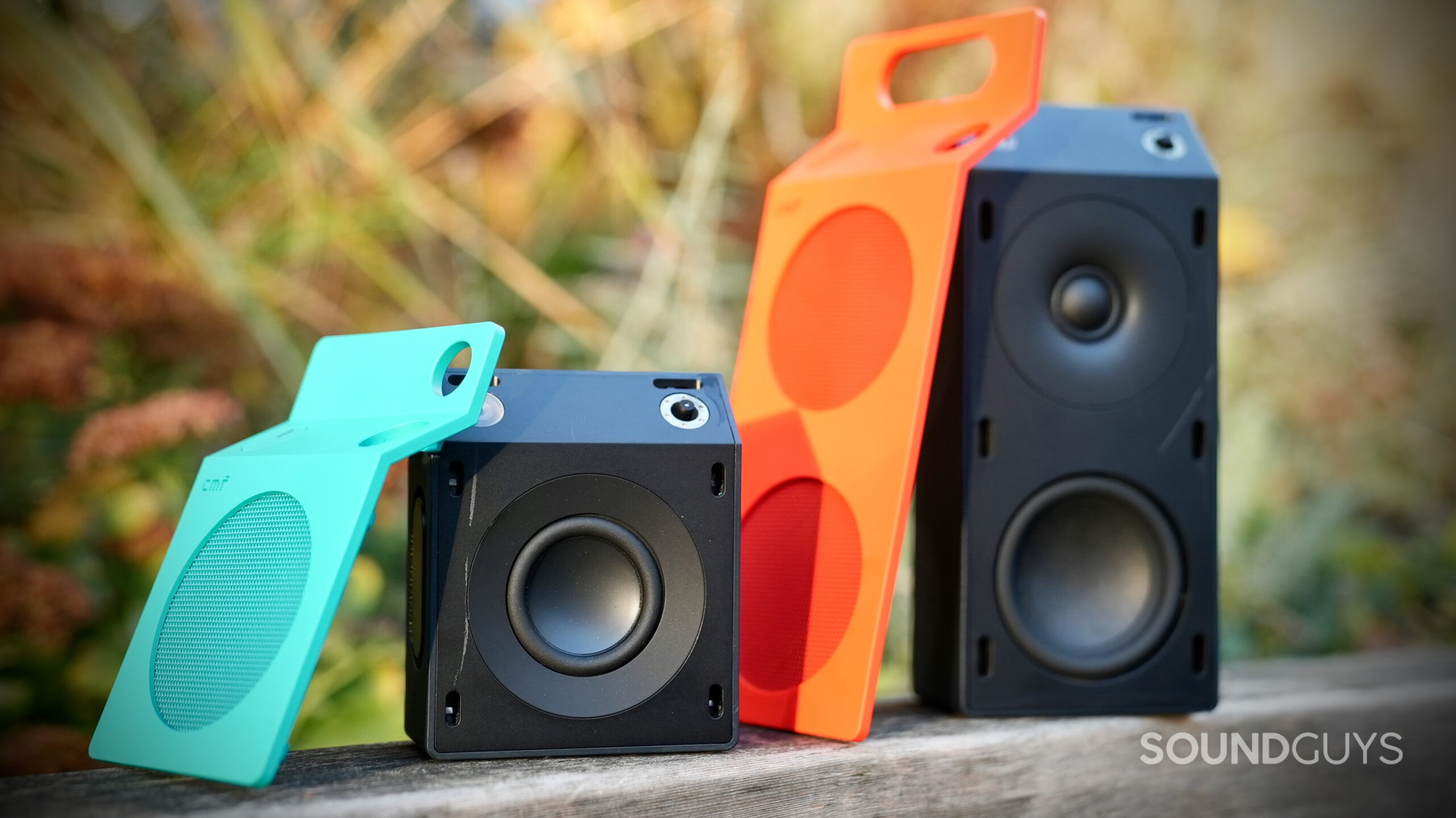 CMF Speaker S and Speaker M with their colorful front faceplates removed, exposing the speakers' drivers.