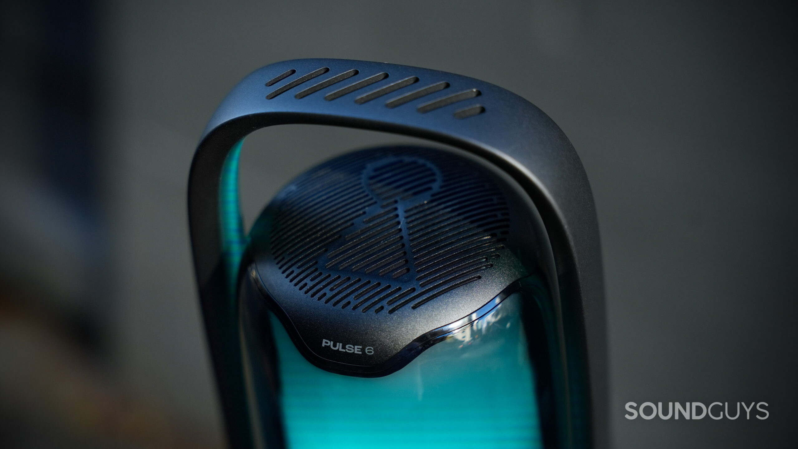 Close-up of the JBL Pulse 6's integrated handle and top speaker grille.