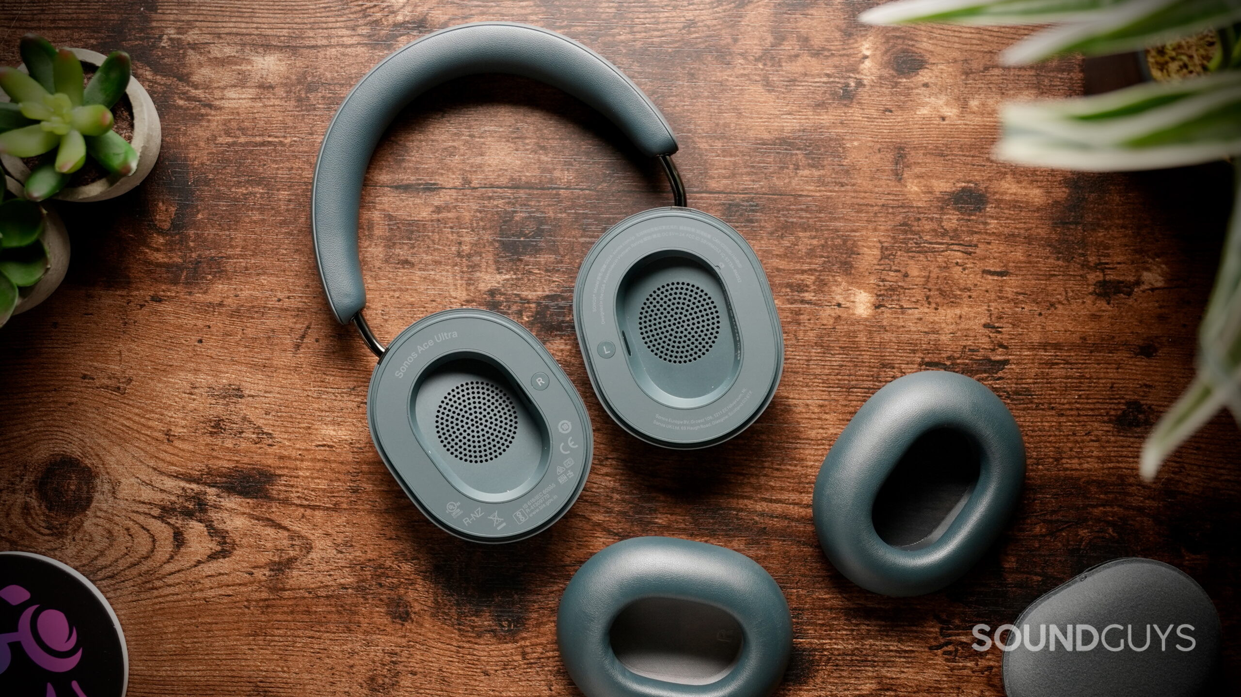 Close-up of the Sonos Ace Ultra with one removable ear cushion detached.