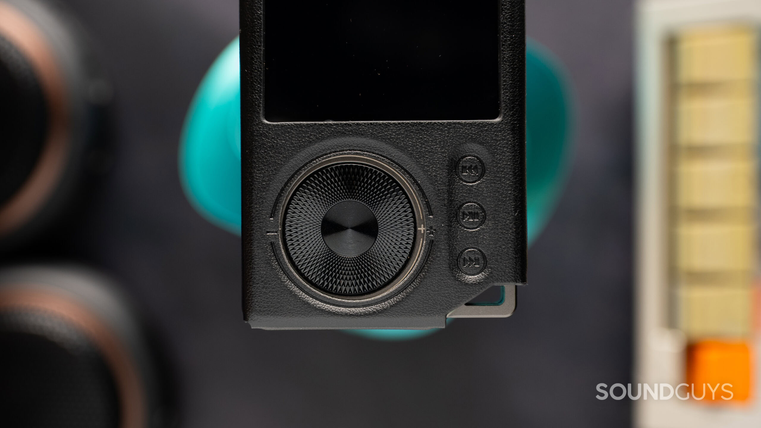 Surfans F20 Pro+ buttons in case close up The Surfans F20 Pro+ inside case with an offset hole.